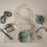Mushie Bavoir Bébé en Silicone - Dinosaures