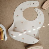 Mushie Bavoir Bébé en Silicone - Arcs-en-ciel